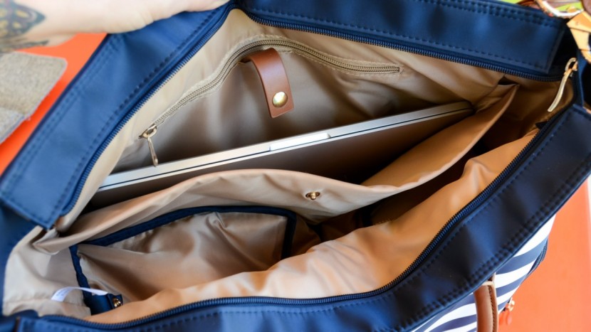 sarah wells abby - roomy interior with a divider designed for your laptop.