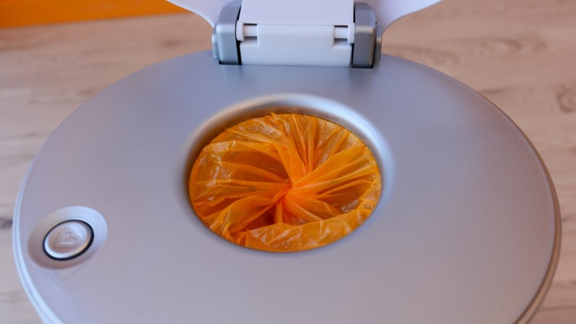 munchkin step - the hole to put diapers through in the step is a bit small for our...