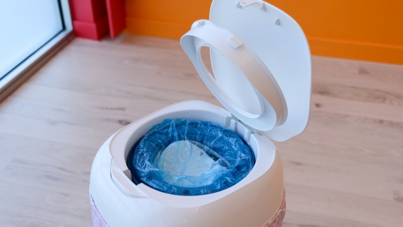 playtex diaper genie expressions - the lid on the expressions releases easily to place a new cartridge...