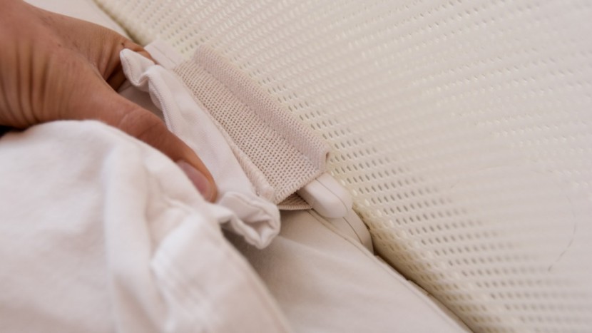 snoo smart sleeper - stretchy fabric found on both sides of the swaddle slip over a...