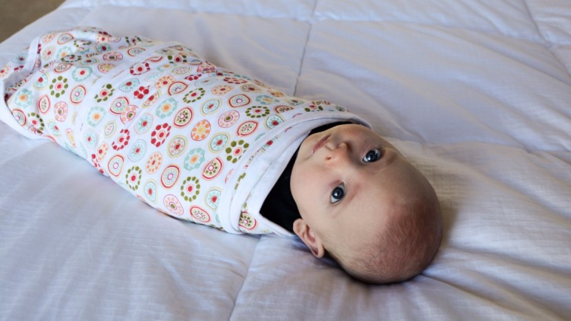 swaddle and sleep sack - back is best for nap time and nighttime.