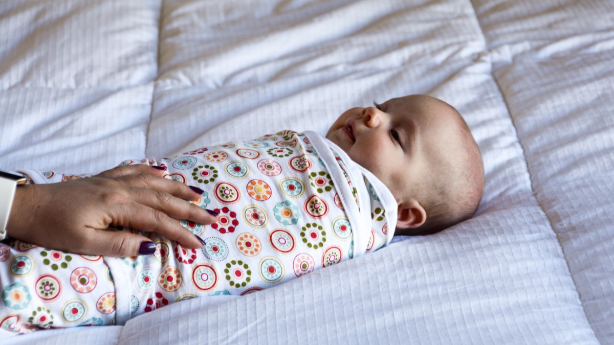 Miracle Blanket Review (Baby is snug and cozy in the Miracle Blanket swaddle.)