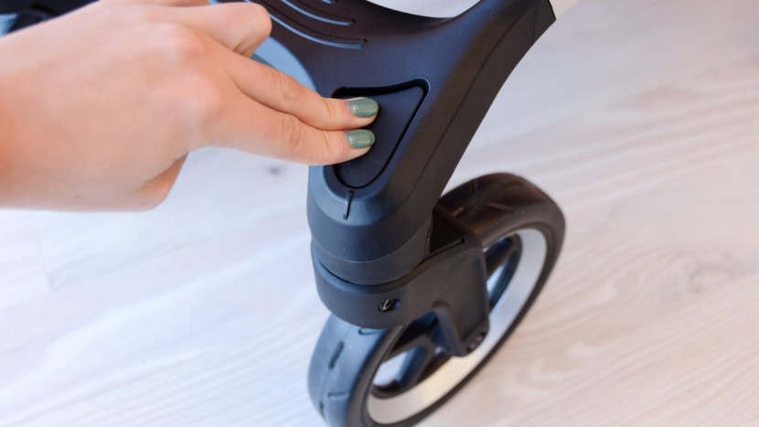 the sleek's front wheels can be locked in place with the push of a...