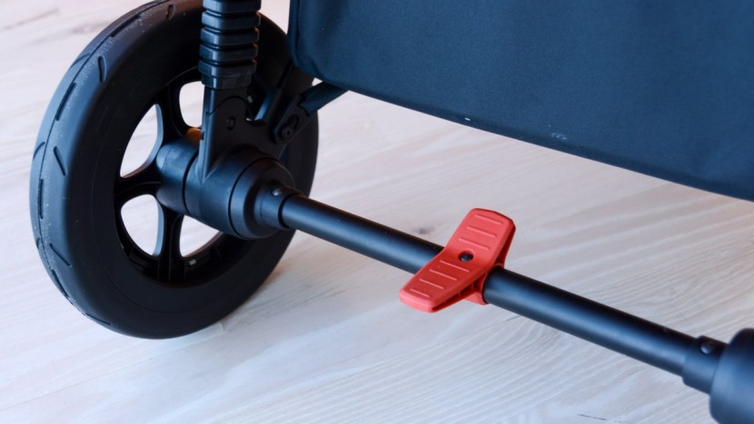 thule sleek - the sleek has a rocker brake that is easy to use and great for feet...