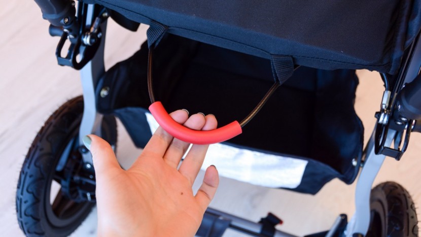 the folding handle is located under the rambler seat.