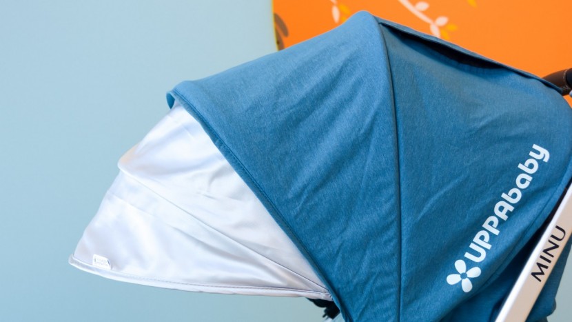 the minu has a large canopy with a sun visor and covered peek-a-boo...