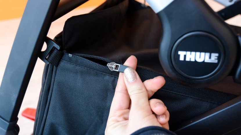 the sleek's zippered cover helps keep the storage bin contents clean...