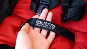 The B-Lively folds with the pull of a strap located on the seat...