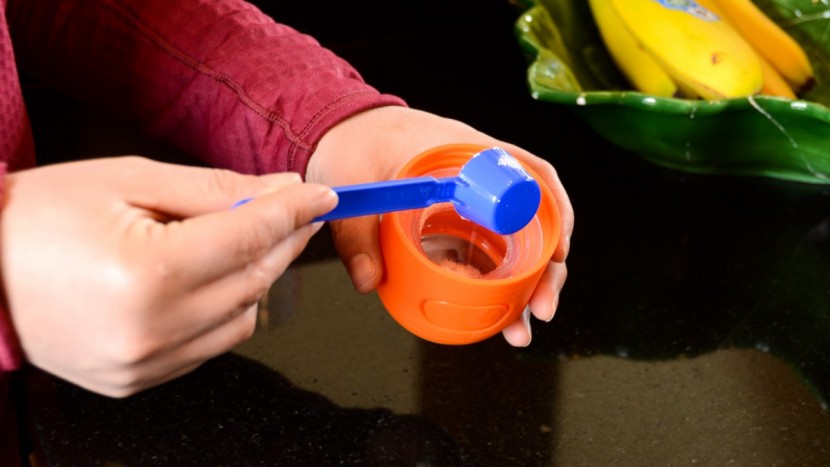 the formula gets scooped and stored in the nipple section of the...