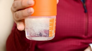 The sealing disk falls into the water with the powdered formula and...
