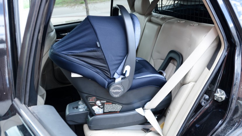 infant car seat - installing the car seat base with a vehicle seat belt can come into...