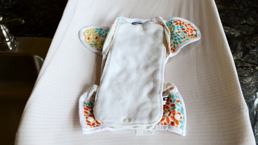 thirsties duo wrap with stay dry duo insert - lay the cover down, and lay the insert down. the simple two-step...