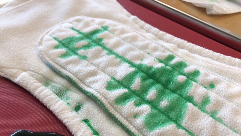 we used a mock urine solution mixed with green dye to see the...