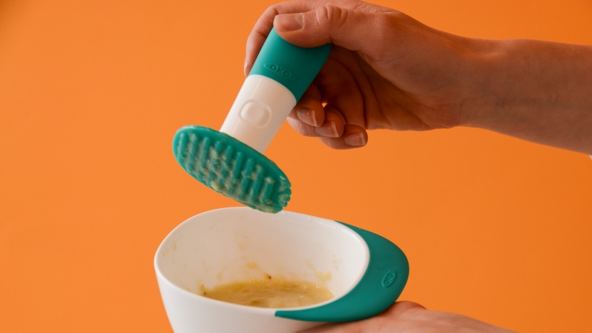 oxo tot food masher - the oxo is manual, and the masher has teeth and groves, plus the...