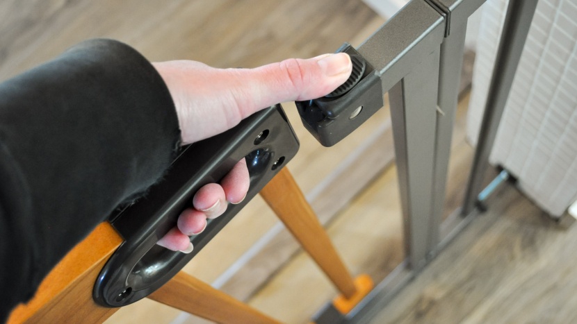 baby gate - the latch/lock on the decorative wood &amp;amp; metal baby gate works...