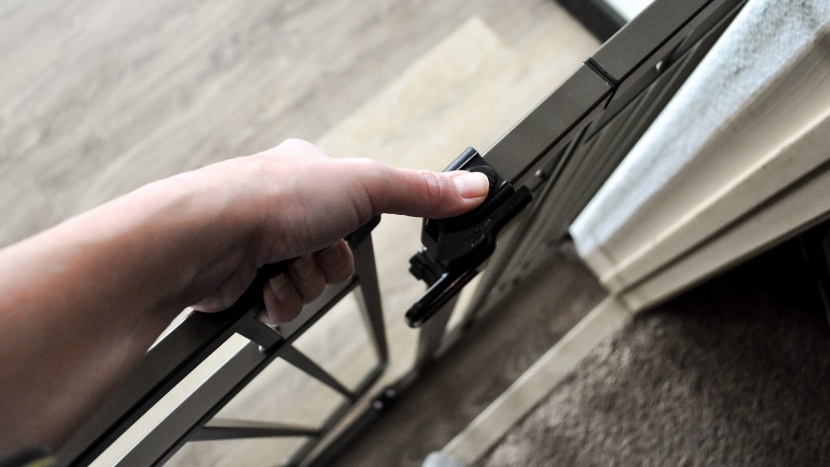 baby gate - the summer infant extra tall gate has a slide latch you can operate...