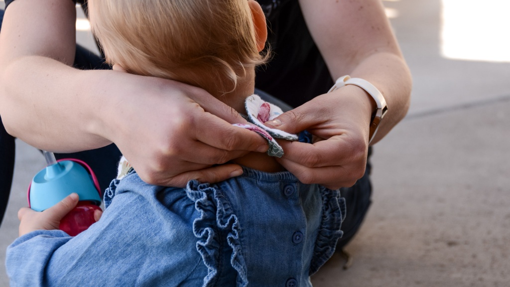 baby bib - the nuby reversible muslin teething bib is easy to put on and take...