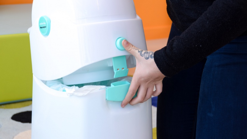 opening the lid of the creative baby tidy requires pushing a button...