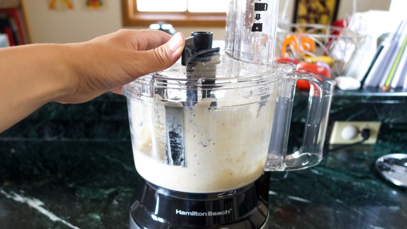 the bowl scraper moves ingredients that stick to the wall towards...