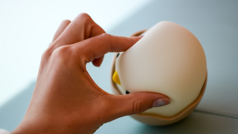 night light - the smart chick has silicone material on top with plastic on the...