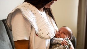 The Aden + Anais Burpy Bib is thinner in the middle and wider at the...