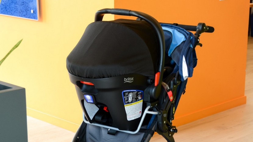 the infant car seat carrier clicks onto the adapter frame but also...
