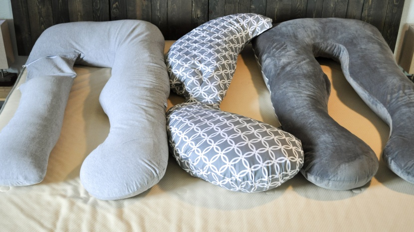 pregnancy pillow - the smaller compact size of the boppy (center) might be good for...