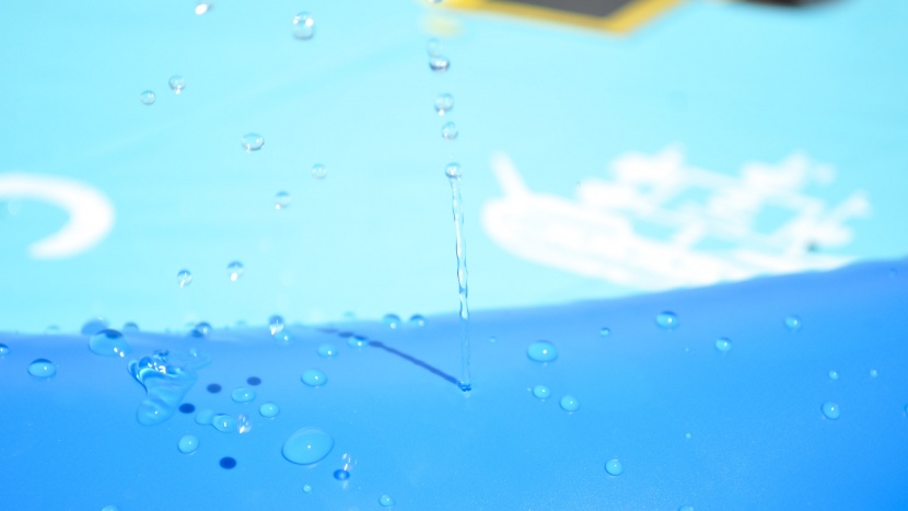 the obuby splash pad and the palm tree offer a shallow splashing...