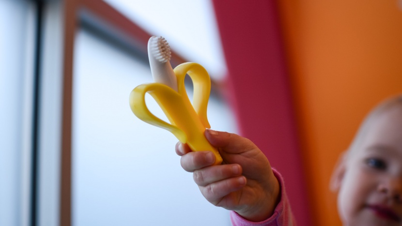 the baby banana infant toothbrush is easy for little hands to hold...