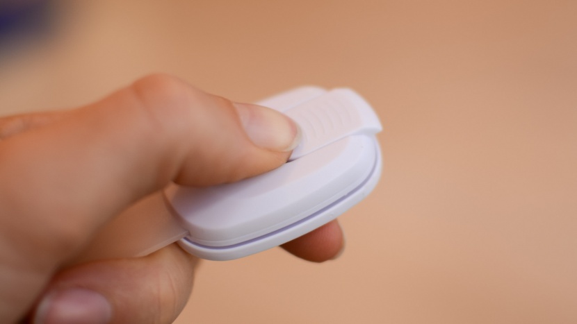 the betertek adhesive straps unlock by sliding the button forward...