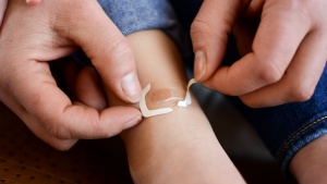 Remove, peel, and press to seal the Nexcare Clear Waterproof...