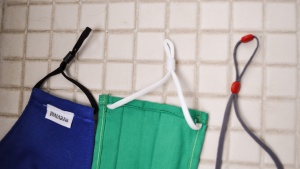 The ear strap on the DropSkins (far right) include a silicone end...