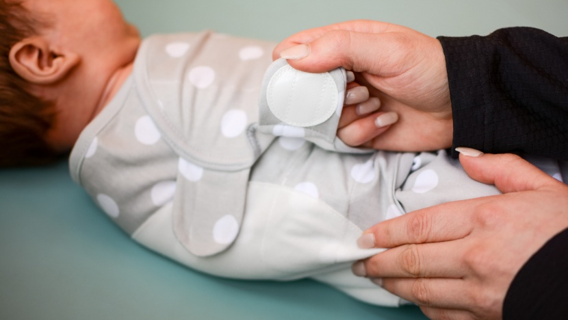 swaddle and sleep sack - the comfy cubs is simple and straightforward, plus uses velcro tabs...