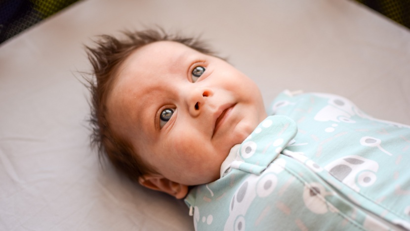 swaddle and sleep sack - many zipper-style products leave a pull tab and/or extra fabric at...