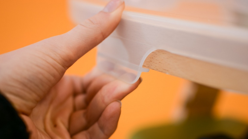 abiie beyond wooden high chair - the plastic tray on the abiie is easy to remove with a single hand.