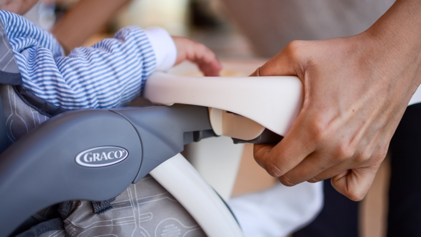 graco slim snacker high chair - removing the slim snacker tray is somewhat stiff and requires two...