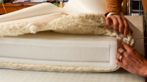 The Naturepedic Organic Crib Mattress - Dual Firmness has multiple...