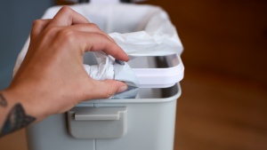 The Skip Hop Nursery Style has an inner plastic ring that holds bags...