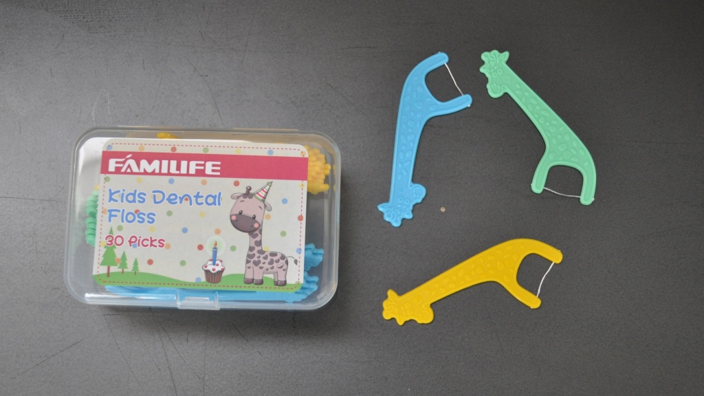 kids flossers - the plastic travel container on the familife flossers is handy and...