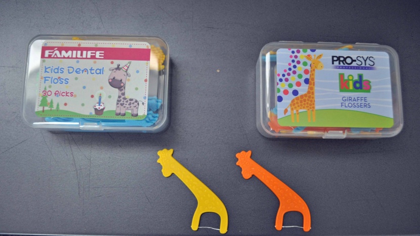 kids flossers - these two flossers appear to be identical in every way but brand and...