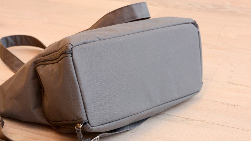 the bottom of the carryall is flat and unadorned like other less...