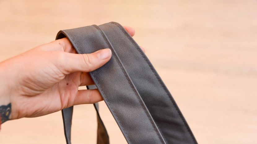 the shoulder straps on the carryall are wide and unpadded.