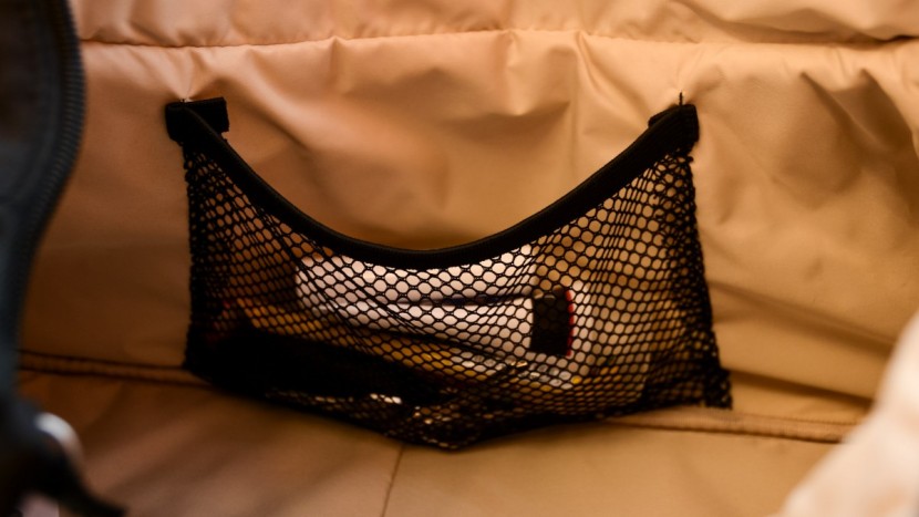 the medela has a small internal mesh pocket for small quick-access...