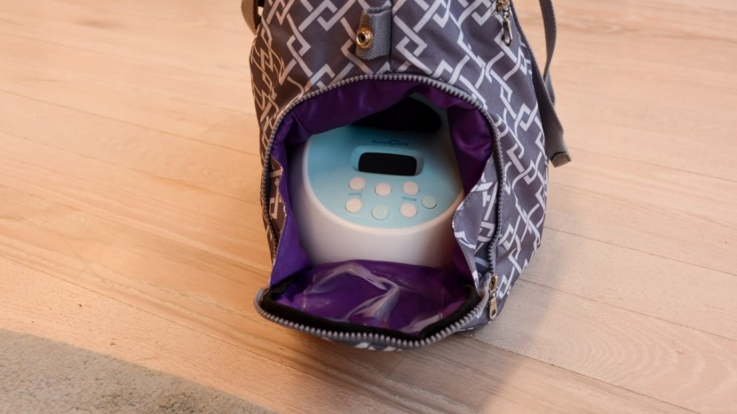 the side pocket on the lizzy fits almost any size pump.
