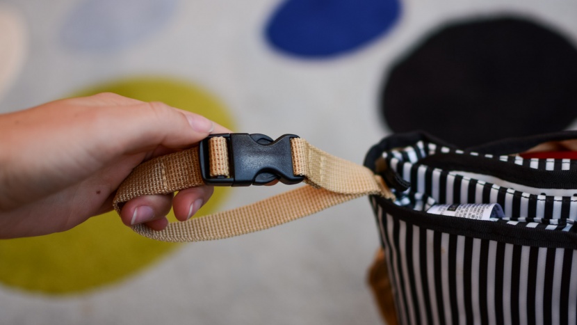a buckle strap on the side of the bag allows you to clip it to your...