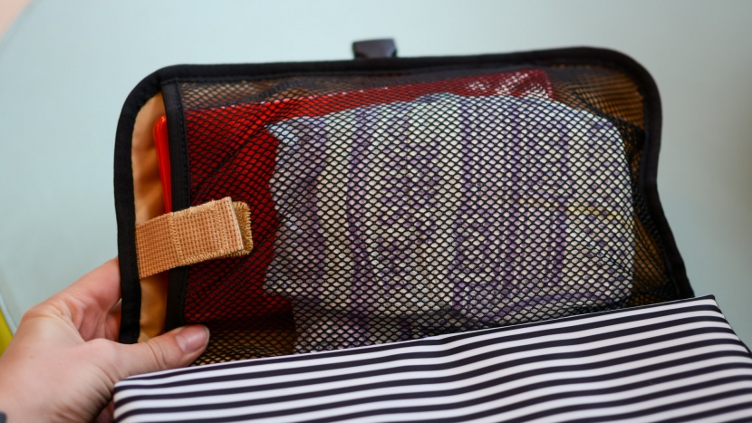 the mesh pocket is large enough to hold 4-6 diapers, and the...