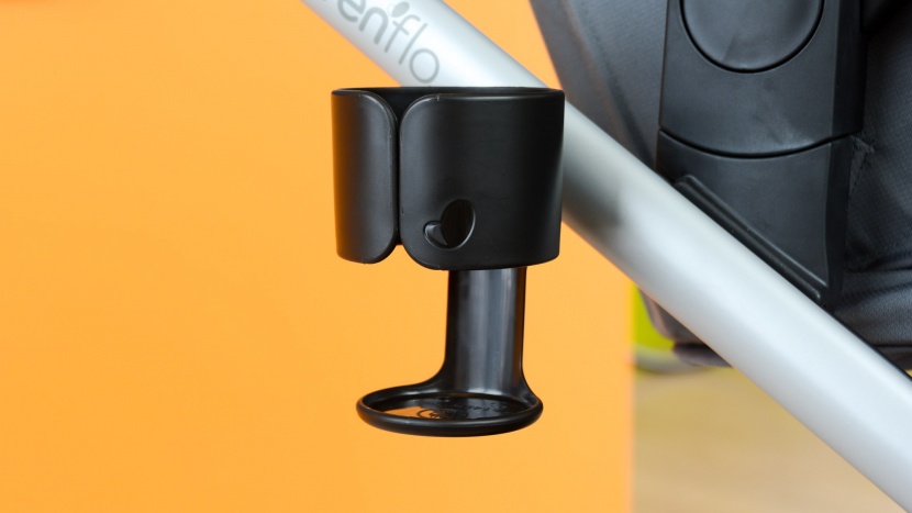 the evenflo has a cup holder on the side of the frame that can hold...