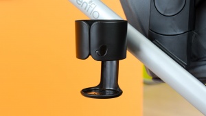 The Evenflo has a cup holder on the side of the frame that can hold...