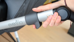 You need to unlock the Evenflo frame before you can fold it.