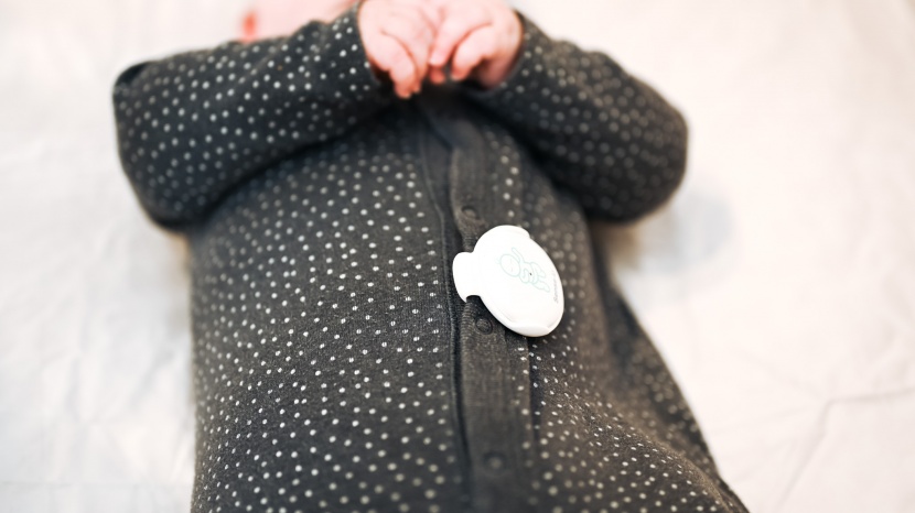 baby monitor - the sensu-u baby v3 is a button-style wearable.